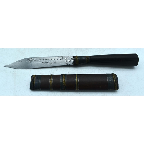 1844 - A MIDDLE EASTERN DAGGER WITH A WOOD HANDLE AND SHEATH.  BLADE ENGRAVED WITH SCRIPT.  Knife 24cm long