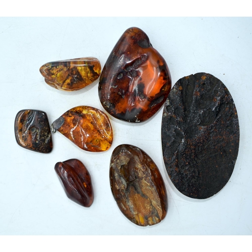 1845 - SEVEN AMBER TYPE DECORATIVE PEBBLES.  Largest 11.8 cm x 7cm x 2.5cm (7)