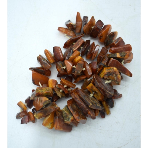 1848 - THREE AMBER COLOURED BEAD NECKLACES.  Longest 148cm (3)