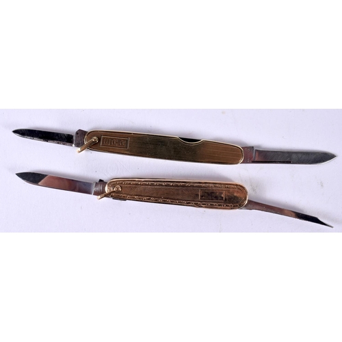 1873 - TWO GOLD CASED FOLDING KNIVES.  Stamped 14K and 10K,  Largest 6.5cm (closed), 13.6 cm (extended)