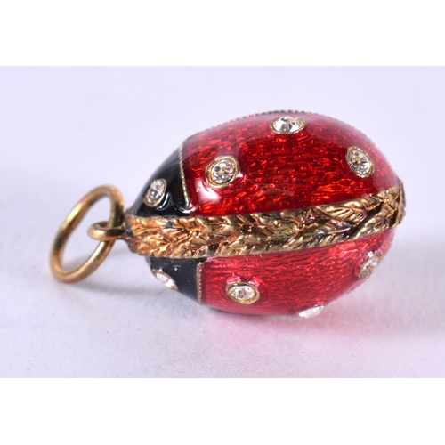 1879 - A SILVER AND ENAMEL LADYBIRD PENDANT.  Stamped 925, 2 cm x 1.3cm, weight 6.5g