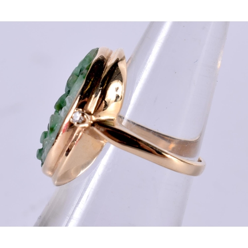 1880 - A GOLD RING SET WITH JADE AND TWO SHOULDER MOUNTED DIAMONDS.  Size K, weight 6g