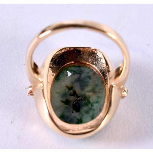 1880 - A GOLD RING SET WITH JADE AND TWO SHOULDER MOUNTED DIAMONDS.  Size K, weight 6g