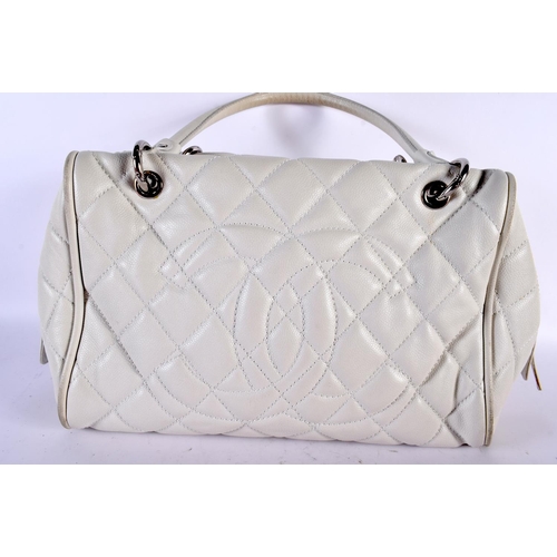 1882 - A WHITE LEATHER CHANEL HANDBAG.  40cm x 23cm x 17cm (excl handles)