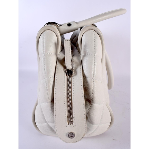 1882 - A WHITE LEATHER CHANEL HANDBAG.  40cm x 23cm x 17cm (excl handles)