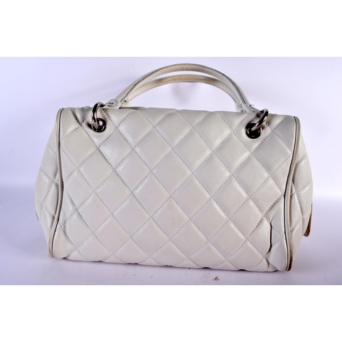 1882 - A WHITE LEATHER CHANEL HANDBAG.  40cm x 23cm x 17cm (excl handles)