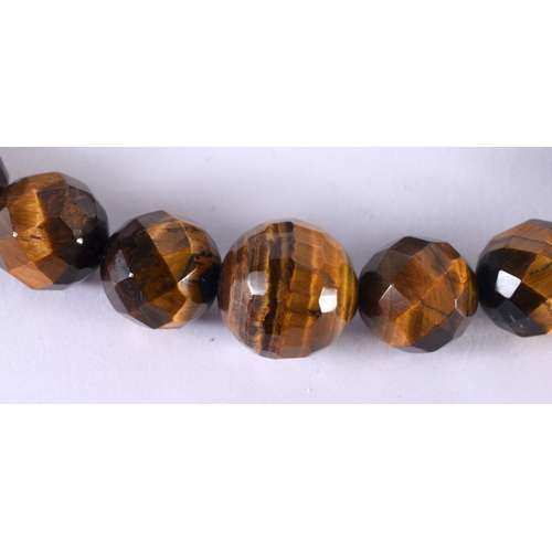 1890 - A TIGERS EYE BEAD NECKLACE.  45cm long, Largest bead 15.4mm, weight 76g