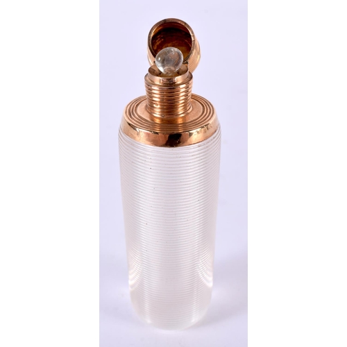 1902 - A GOLD TOPPED RIBBED GLASS SCENT BOTTLE.  8.8 cm x 2.5cm