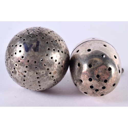 1904 - TWO WHITE METAL TEA INFUSERS. Largest 6.3cm x 3.7cm, total weight 80g (2)