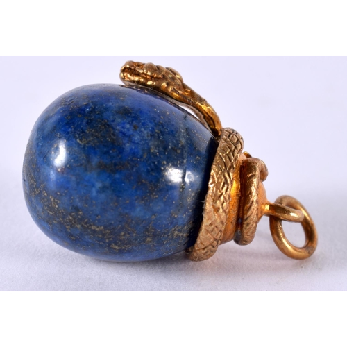 1910 - A LAPIS PENDANT WITH A SILVER GILT SERPENT MOUNT.  Stamped 84, 2.8 cm x 2 cm, weight 13.7g