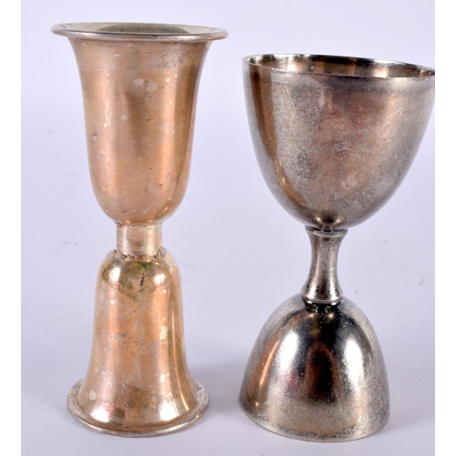 1912 - TWO WHITE METAL DRINKS MEASURE CUPS.  Largest 10.9cm x 4.6 cm (2)