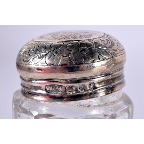 1922 - TWO ANTIQUE SILVER TOPPED JARS. London 1893. Silver 41 grams. Largest 9 cm x 7.5 cm. (2)