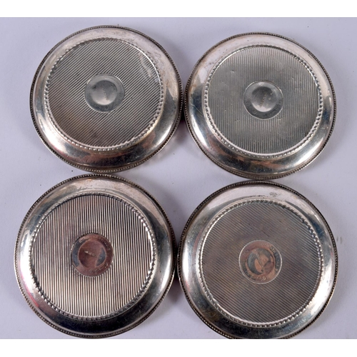 1924 - FOUR VINTAGE SILVER COASTERS.326 grams overall. 9 cm diameter. (4)