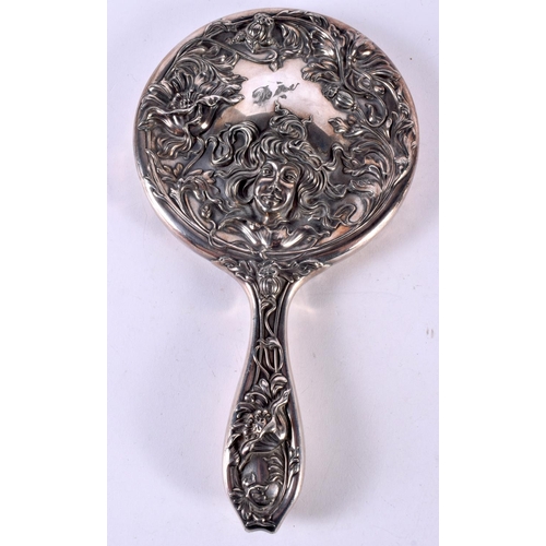 1947 - AN ART NOUVEAU SILVER PLATED HAND MIRROR. 380 grams overall. 24.5 cm x 13.5 cm.