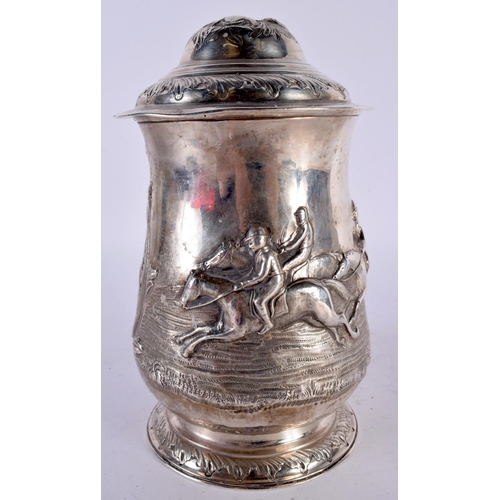 1960 - A VERY UNUSUAL GEORGE III REPOUSSE SILVER EQUESTRIAN TANKARD. London 1766. 673 grams. 19 cm x 19 cm.