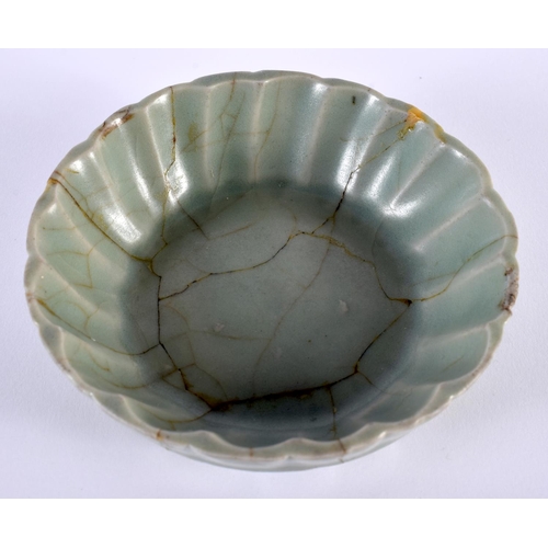 2013 - A CHINESE MING DYNASTY MONOCHROME PORCELAIN BRUSH WASHER of scalloped form. 10.5 cm wide.