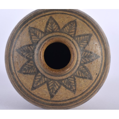 2014 - AN EARLY SOUTHEAST ASIAN POTTERY VESSEL possibly Vietnamese, painted with floral scrolls. 10 cm x 7c... 