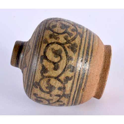 2014 - AN EARLY SOUTHEAST ASIAN POTTERY VESSEL possibly Vietnamese, painted with floral scrolls. 10 cm x 7c... 