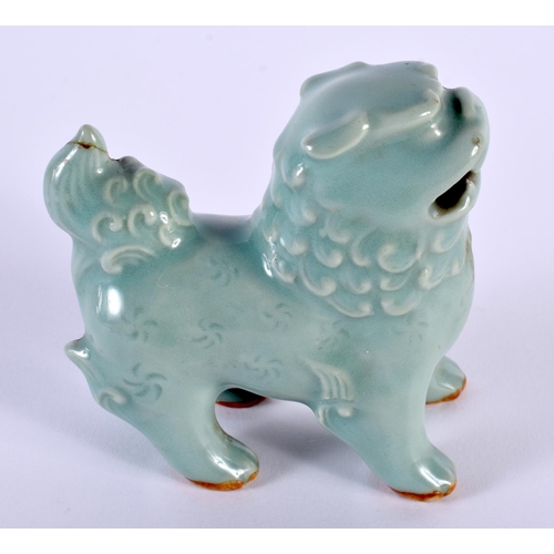 2015 - A 19TH CENTURY KOREAN CELADON GLAZED PORCELAIN BEAST modelled scowling. 9 cm x 9 cm.