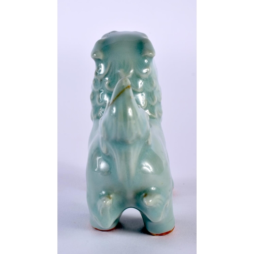 2015 - A 19TH CENTURY KOREAN CELADON GLAZED PORCELAIN BEAST modelled scowling. 9 cm x 9 cm.