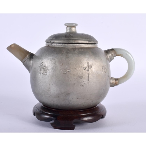 2025 - AN EARLY 20TH CENTURY CHINESE SILVERED YIXING POTTERY JADE TEAPOT AND COVER Late Qing/Republic. 15cm... 