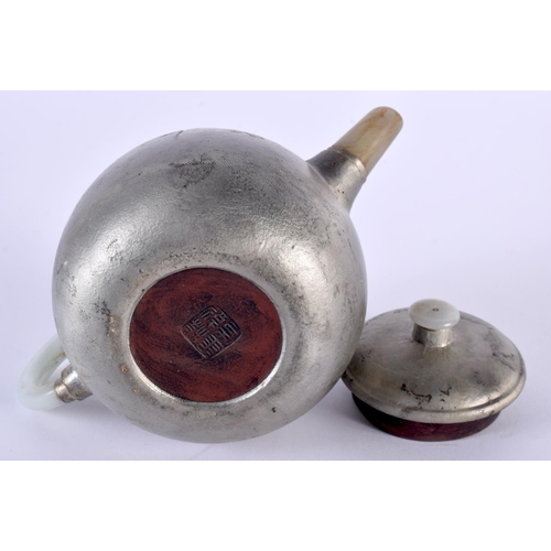 2025 - AN EARLY 20TH CENTURY CHINESE SILVERED YIXING POTTERY JADE TEAPOT AND COVER Late Qing/Republic. 15cm... 