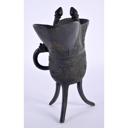 2032 - A CHINESE QING DYNASTY BRONZE JUE WINE VESSEL decorated with archaic motifs and emblems. 18cm x 15cm... 