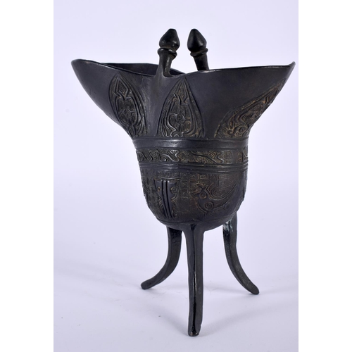 2032 - A CHINESE QING DYNASTY BRONZE JUE WINE VESSEL decorated with archaic motifs and emblems. 18cm x 15cm... 