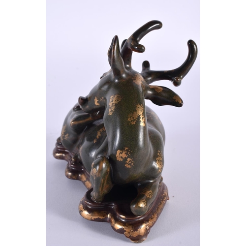 2035 - A RARE CHINESE QING DYNASTY TEA DUST GLAZED PORCELAIN FIGURE OF A STYLISED STAG Qianlong mark and po... 