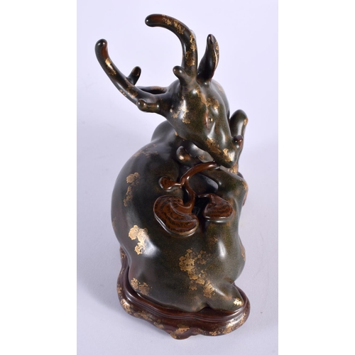 2035 - A RARE CHINESE QING DYNASTY TEA DUST GLAZED PORCELAIN FIGURE OF A STYLISED STAG Qianlong mark and po... 