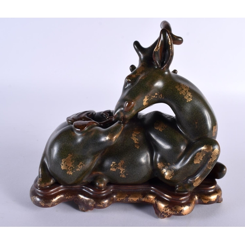 2035 - A RARE CHINESE QING DYNASTY TEA DUST GLAZED PORCELAIN FIGURE OF A STYLISED STAG Qianlong mark and po... 