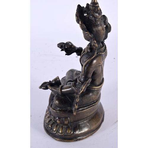 2048 - A 19TH CENTURY TIBETAN NEPALESE BRONZE FIGURE OF A SEATED BUDDHA modelled holding buddhistic items, ... 