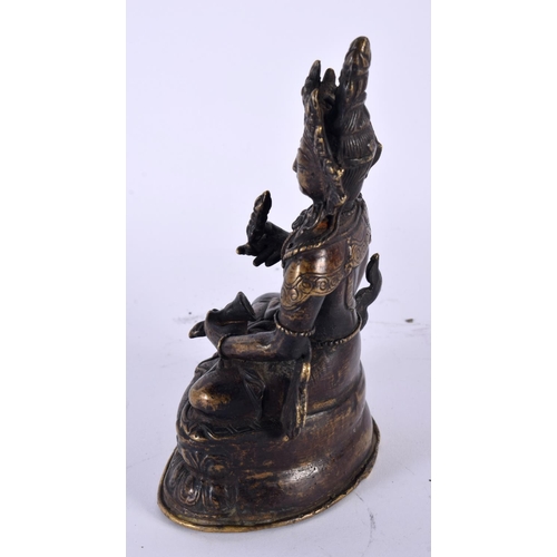 2049 - A 19TH CENTURY TIBETAN NEPALESE BRONZE FIGURE OF A SEATED BUDDHA modelled upon a triangular lotus ca... 