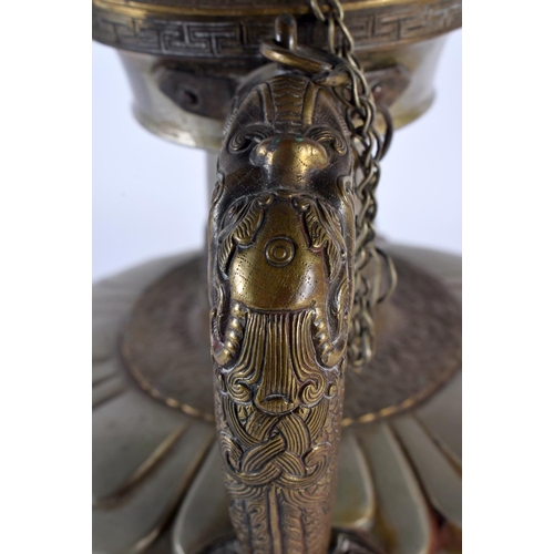 2050 - A LARGE 18TH/19TH CENTURY TIBETAN MIXED METAL BRONZE EWER decorated with dragon mask heads, the rim ... 