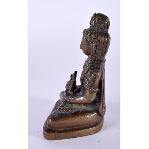 2051 - A GOOD 18TH CENTURY TIBETAN NEPALESE BRONZE FIGURE OF A SEATED BUDDHA modelled holding a stupa, upon... 