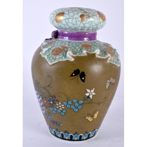 2055 - AN UNUSUAL 19TH CENTURY JAPANESE MEIJI PERIOD PORCELAIN VASE AND COVER imitating cloisonne, painted ... 