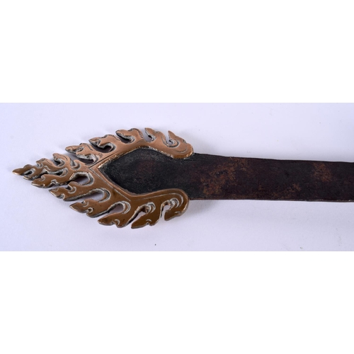 2058 - A RARE 19TH CENTURY TIBETAN FLAMING BUDDHISTIC MASK HEAD KNIFE possibly ceremonial, formed as a drag... 