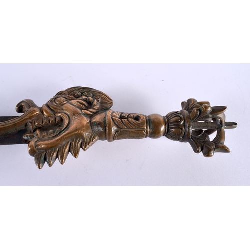 2058 - A RARE 19TH CENTURY TIBETAN FLAMING BUDDHISTIC MASK HEAD KNIFE possibly ceremonial, formed as a drag... 