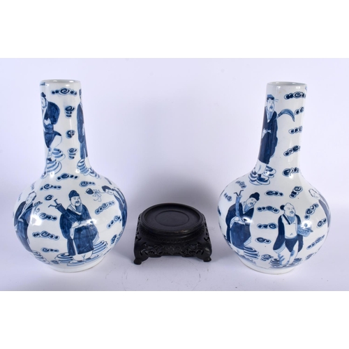 2061 - A PAIR OF CHINESE REPUBLICAN PERIOD BLUE AND WHITE PORCELAIN VASES decorated with figures amongst cl... 