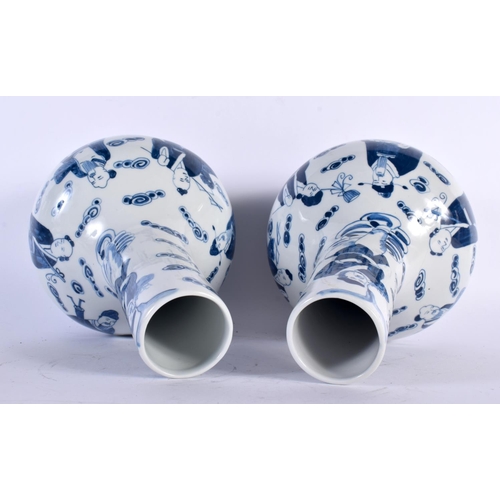 2061 - A PAIR OF CHINESE REPUBLICAN PERIOD BLUE AND WHITE PORCELAIN VASES decorated with figures amongst cl... 