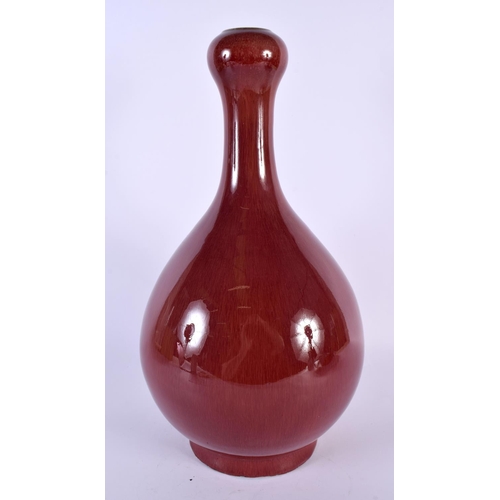 2071 - A LARGE CHINESE FLAMBE GLAZED GARLIC NECK SANG DU BOEUF VASE possibly Qing dynasty. 37 cm high.