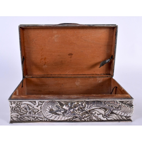 2080 - A LARGE 19TH CENTURY JAPANESE MEIJI PERIOD WHITE METAL DRAGON CASKET AND COVER decorated in relief w... 