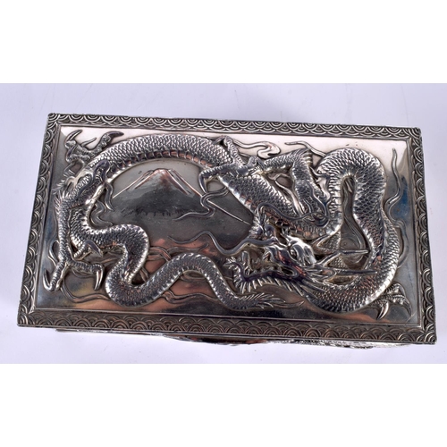 2080 - A LARGE 19TH CENTURY JAPANESE MEIJI PERIOD WHITE METAL DRAGON CASKET AND COVER decorated in relief w... 