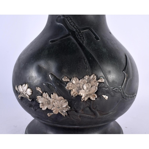 2097 - A LARGE AND UNUSUAL 19TH CENTURY JAPANESE MEIJI PERIOD SILVER OVERLAID BRONZE VASE decorated with a ... 