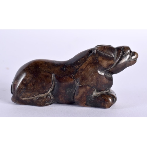 2102 - A CHINESE QING DYNASTY MUTTON JADE FIGURE OF A BEAST modelled recumbent. 5.5 cm wide.