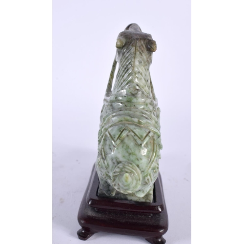 2125 - AN EARLY 20TH CENTURY CHINESE CARVED JADE FIGURE OF A HORSE Late Qing/Republic. 15cm x 15cm.