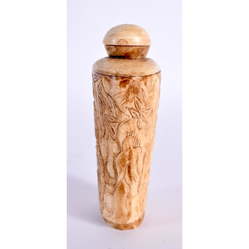 2137 - A 19TH CENTURY CHINESE CARVED BONE SNUFF BOTTLE AND STOPPER Qing, depicting figures within landscape... 