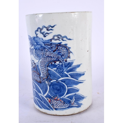 2148 - A CHINESE BLUE AND WHITE IRON RED DRAGON PORCELAIN BRUSH POT 20th Century. 15cm high.