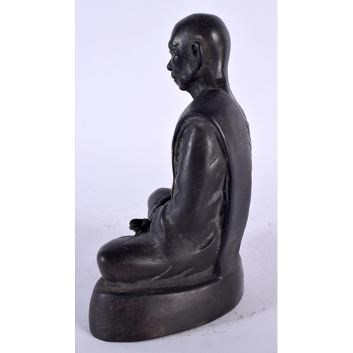 2153 - A CHINESE TIBETAN BRONZE FIGURE OF AN ELDERLY BUDDHA 20th Century. 16 cm high.