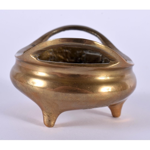 2166 - A MINIATURE 19TH CENTURY CHINESE TWIN HANDLED BRONZE CENSER bearing Xuande marks to base. 102 grams.... 